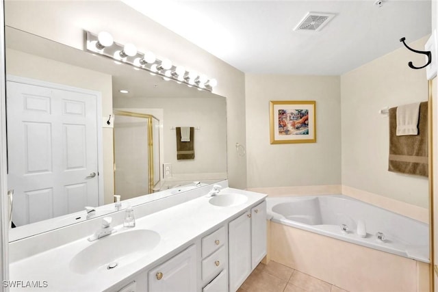 2190 Arielle Dr Unit 903, Naples, FL 34109 - bathroom featuring a sink, visible vents, tile patterned flooring, a shower stall, and a garden tub