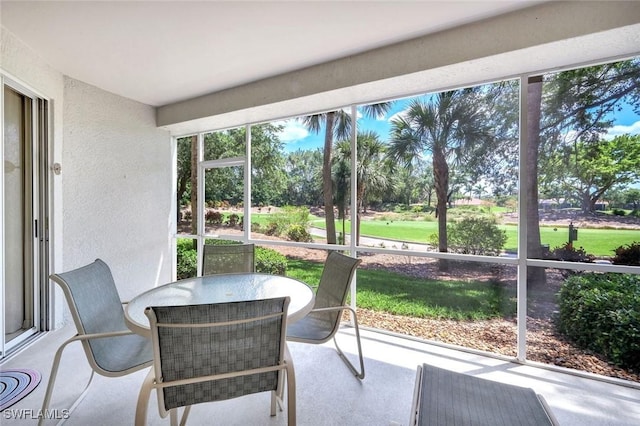 2190 Arielle Dr Unit 903, Naples, FL 34109 - sunroom with outdoor dining area