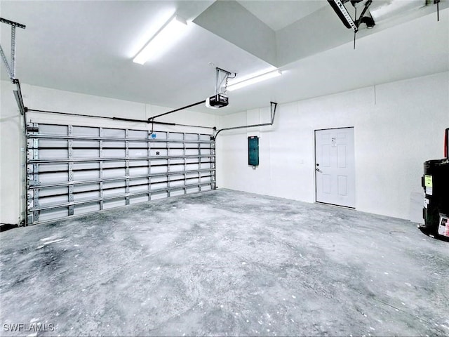 3400 23rd St W, Lehigh Acres, FL 33971 - garage with a garage door opener and electric water heater
