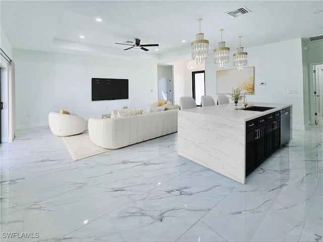 3400 23rd St W, Lehigh Acres, FL 33971 - kitchen with pendant lighting, dark cabinets, a sink, ceiling fan with notable chandelier, and dishwasher