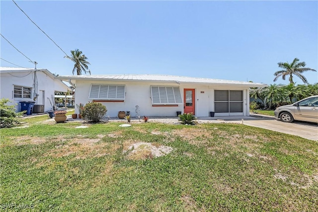 3797 Emerald Ave, Saint James City, FL 33956 - ranch-style home featuring a front yard and stucco siding