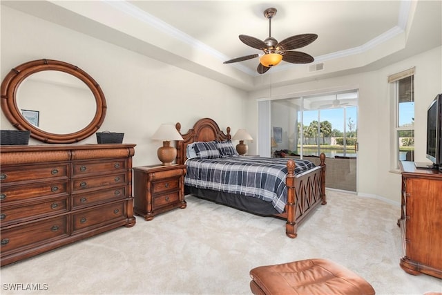 bedroom featuring a tray ceiling, crown molding, access to exterior, visible vents, and light carpet