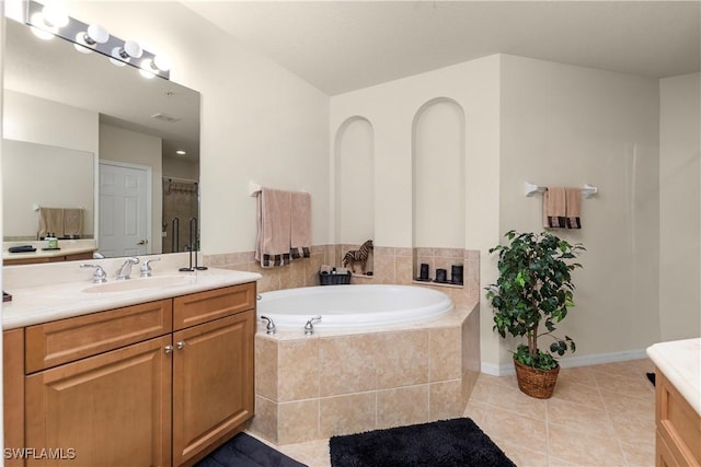 full bathroom with a garden tub, tile patterned flooring, vanity, and a shower with door