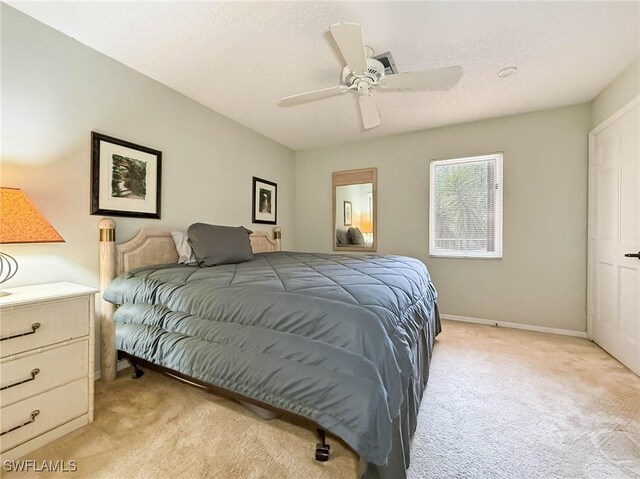 1632 Spoonbill Ln Unit B, Naples, FL 34105 - bedroom featuring light carpet, ceiling fan, and baseboards