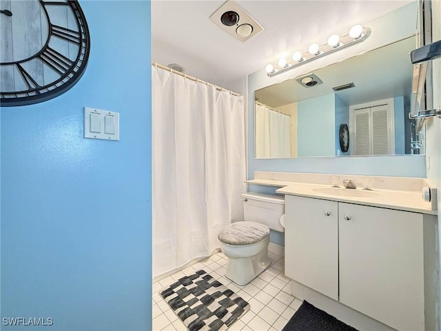 1632 Spoonbill Ln Unit B, Naples, FL 34105 - bathroom with tile patterned floors, vanity, and toilet