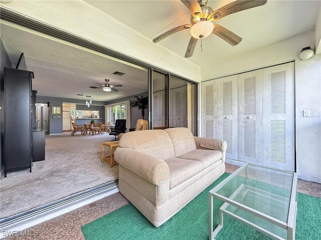 1632 Spoonbill Ln Unit B, Naples, FL 34105 - living area with ceiling fan and carpet floors