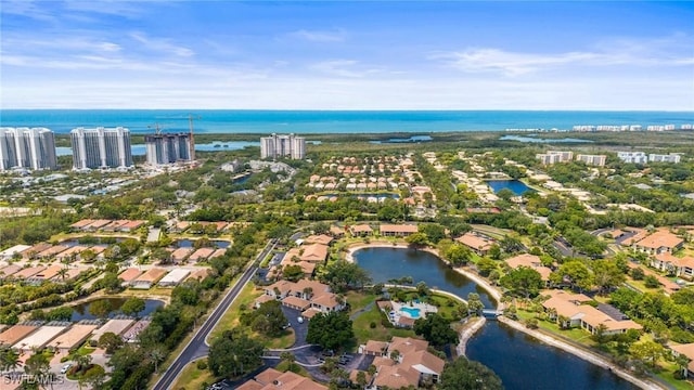 517 Lake Louise Cir Unit 101, Naples, FL 34110 - aerial view of property's location featuring a large body of water and nearby suburban area