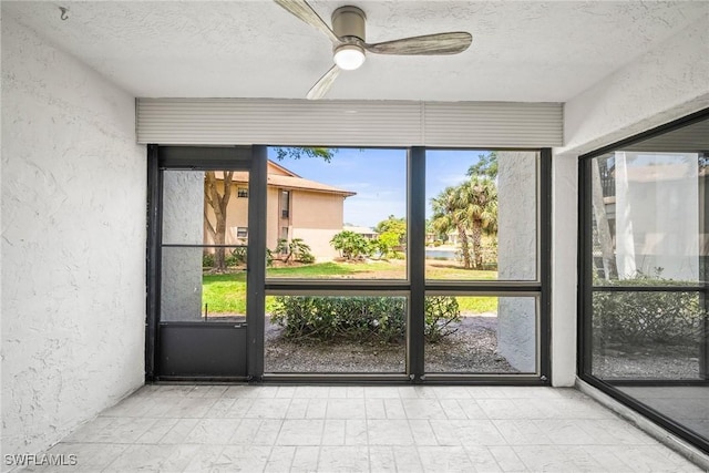 517 Lake Louise Cir Unit 101, Naples, FL 34110 - unfurnished sunroom with ceiling fan