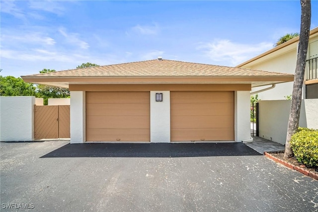 517 Lake Louise Cir Unit 101, Naples, FL 34110 - garage featuring a gate
