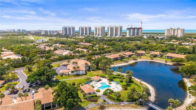 517 Lake Louise Cir Unit 101, Naples, FL 34110 - view of urban area with a large body of water and a pool area