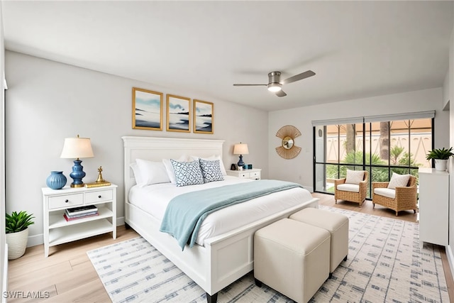 517 Lake Louise Cir Unit 101, Naples, FL 34110 - bedroom with light wood-type flooring and ceiling fan