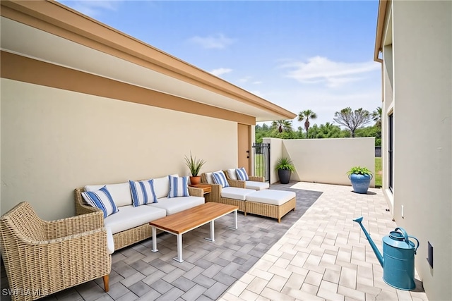 517 Lake Louise Cir Unit 101, Naples, FL 34110 - view of patio / terrace with outdoor lounge area and a gate