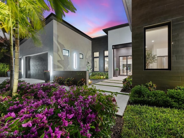 view of front of property featuring stucco siding and a garage