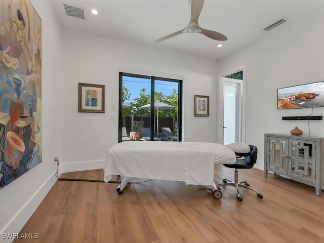 bedroom featuring wood finished floors, visible vents, and recessed lighting