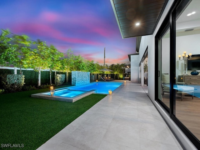 view of swimming pool featuring a patio area, a fenced backyard, a fenced in pool, and a yard