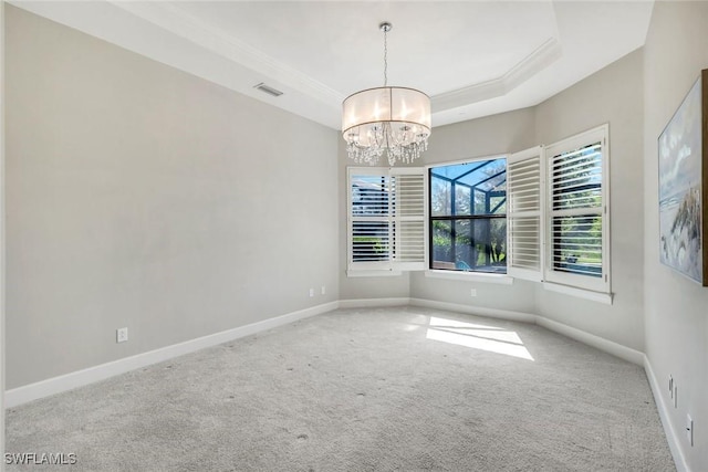 23737 Pebble Pointe Ln, Estero, FL 34135 - carpeted empty room featuring a chandelier, baseboards, a raised ceiling, and crown molding