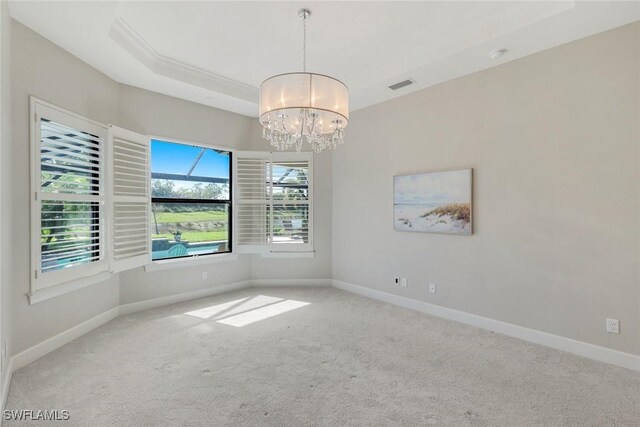 unfurnished room with an inviting chandelier, baseboards, carpet, and visible vents