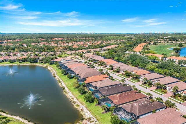 bird's eye view with a water view and a residential view
