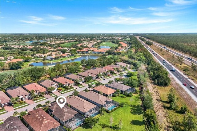 aerial view featuring a water view and a residential view