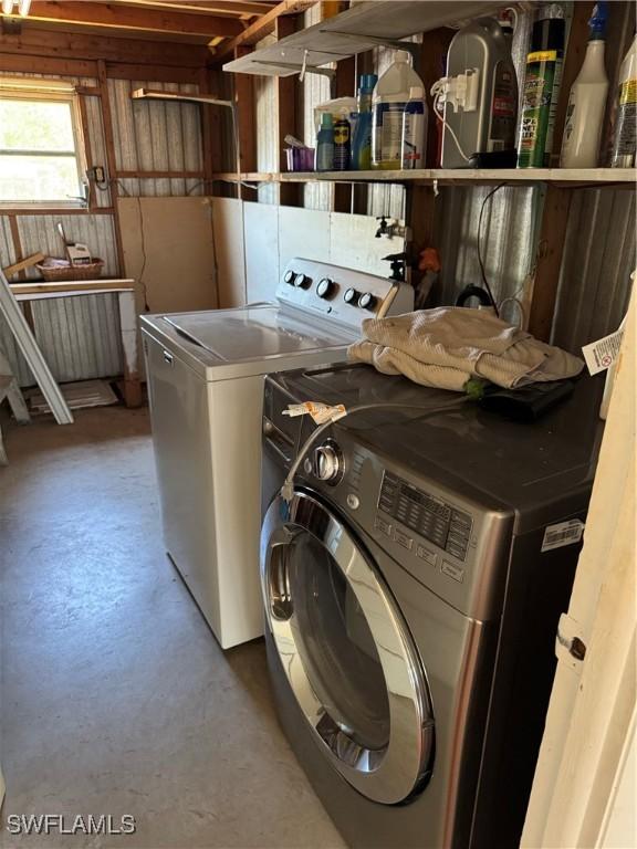 laundry area with separate washer and dryer and laundry area