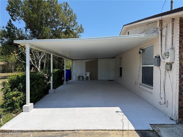 view of vehicle parking featuring a carport