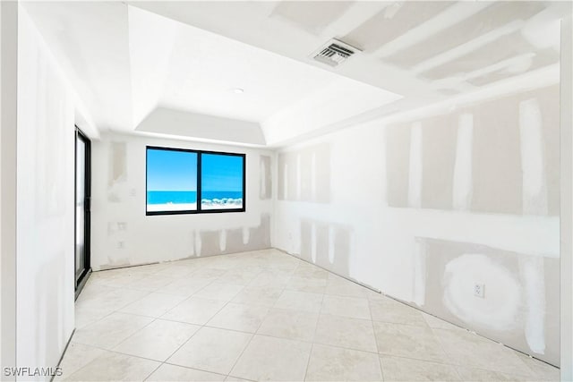 26130 Hickory Blvd Unit 1B, Bonita Springs, FL 34134 - tiled spare room with a tray ceiling