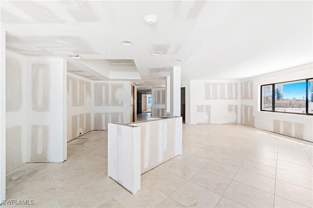 26130 Hickory Blvd Unit 1B, Bonita Springs, FL 34134 - kitchen with open floor plan and light tile patterned flooring