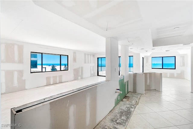 26130 Hickory Blvd Unit 1B, Bonita Springs, FL 34134 - corridor featuring light tile patterned floors