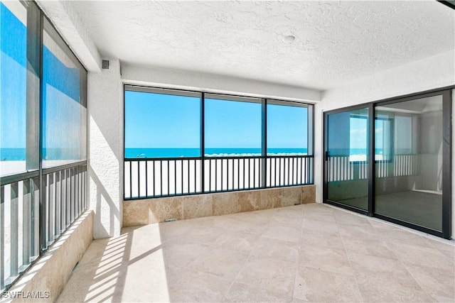 26130 Hickory Blvd Unit 1B, Bonita Springs, FL 34134 - unfurnished sunroom featuring a water view