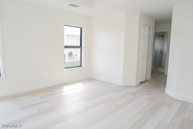 1194 Calico St, Labelle, FL 33935 - spare room with light wood-type flooring, baseboards, and visible vents