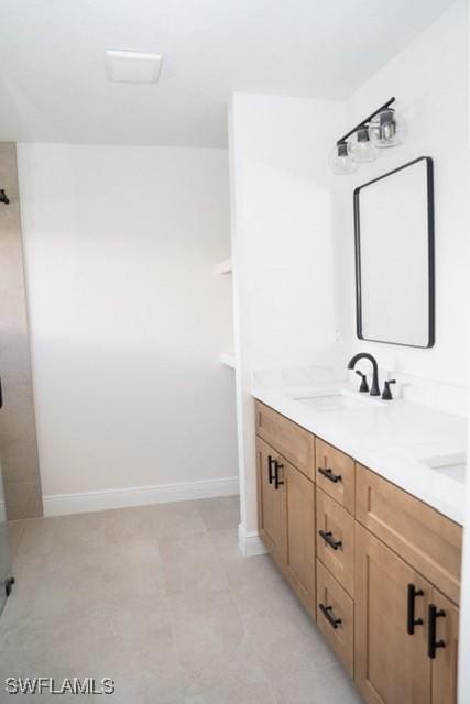 1194 Calico St, Labelle, FL 33935 - bathroom with walk in shower, baseboards, and a sink