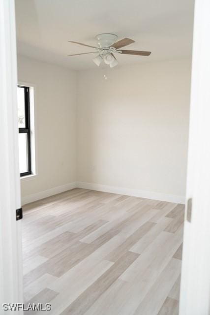 1194 Calico St, Labelle, FL 33935 - unfurnished room featuring baseboards, a ceiling fan, and wood finished floors