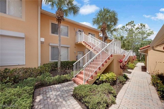 1670 Windy Pines Dr Unit 2506, Naples, FL 34112 - view of building exterior featuring stairs