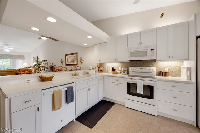 1670 Windy Pines Dr Unit 2506, Naples, FL 34112 - kitchen featuring white appliances, a sink, a peninsula, lofted ceiling, and ceiling fan