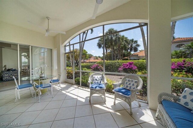 2387 Terra Verde Ln Unit 2387, Naples, FL 34105 - sunroom with tile patterned floors and ceiling fan