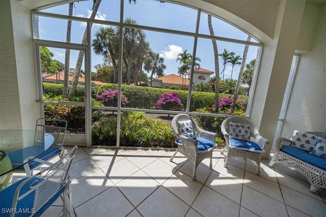 2387 Terra Verde Ln Unit 2387, Naples, FL 34105 - unfurnished sunroom featuring a wealth of natural light