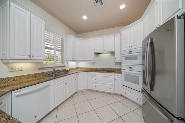 2387 Terra Verde Ln Unit 2387, Naples, FL 34105 - kitchen with visible vents, white cabinetry, a sink, and white appliances