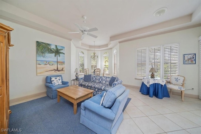 2387 Terra Verde Ln Unit 2387, Naples, FL 34105 - living room featuring ceiling fan, baseboards, light tile patterned flooring, and a raised ceiling