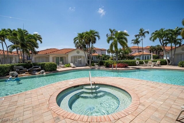 2387 Terra Verde Ln Unit 2387, Naples, FL 34105 - community pool with a hot tub and a patio area