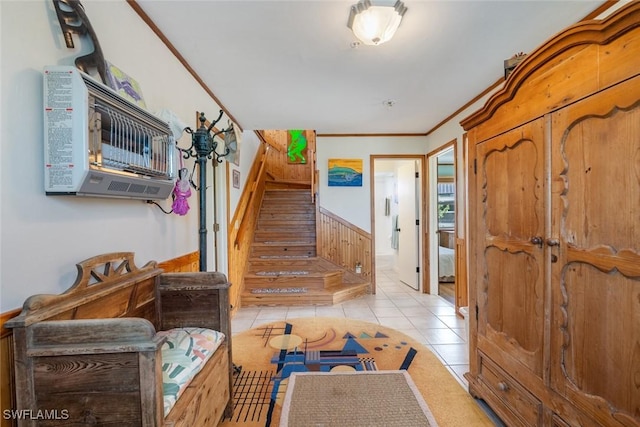 foyer entrance featuring ornamental molding, light tile patterned floors, and stairway