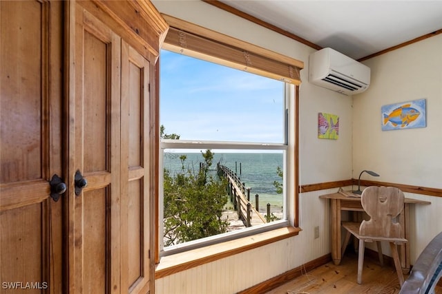 interior space featuring a water view and a wall unit AC