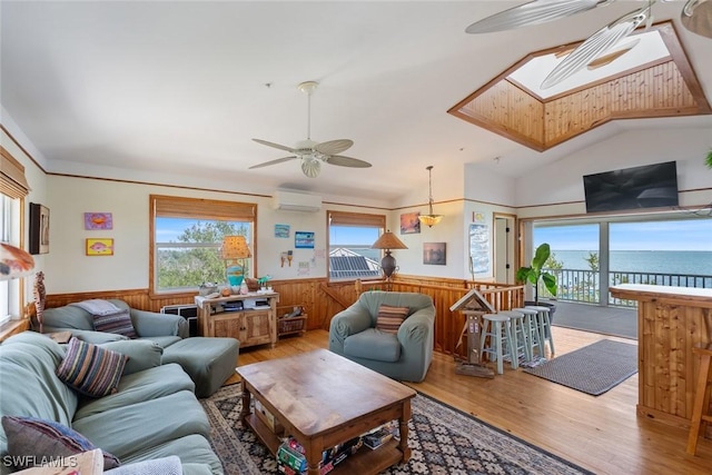 living room featuring wainscoting, ceiling fan, and wood finished floors