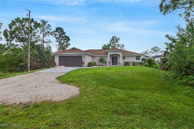 3340 33rd Ave NE, Naples, FL 34120 - view of front facade featuring a garage, a front lawn, driveway, and stucco siding