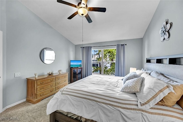carpeted bedroom featuring ceiling fan, vaulted ceiling, and baseboards