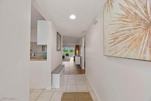 3705 Amberly Cir Unit F102, Naples, FL 34112 - hall with light tile patterned floors and baseboards