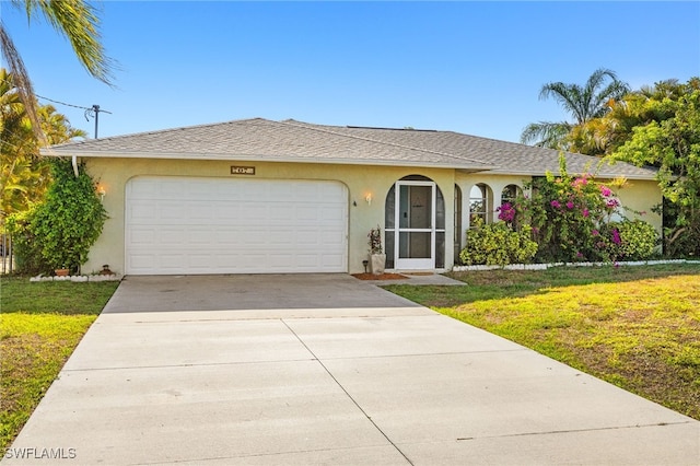 ranch-style house featuring a front yard, driveway, a garage, and stucco siding