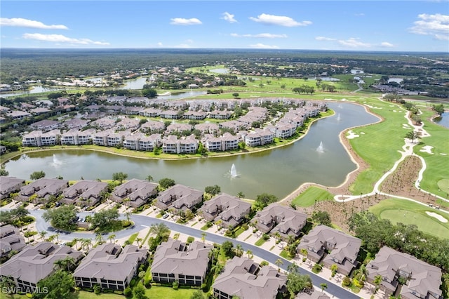 birds eye view of property featuring a residential view, view of golf course, and a water view