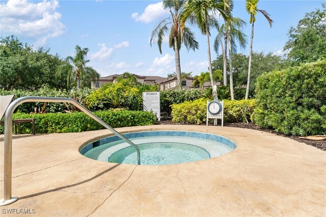 view of pool featuring a hot tub