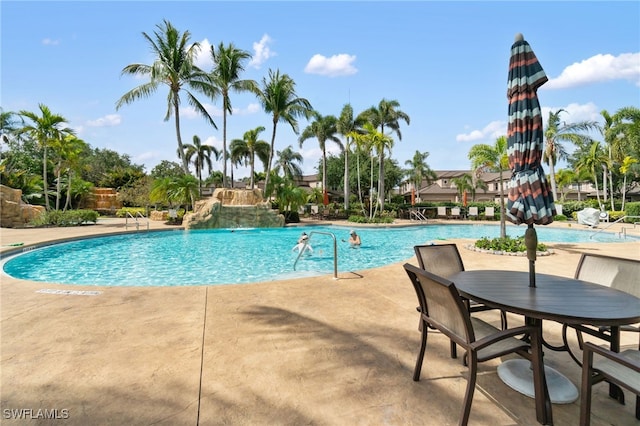 pool with a patio area