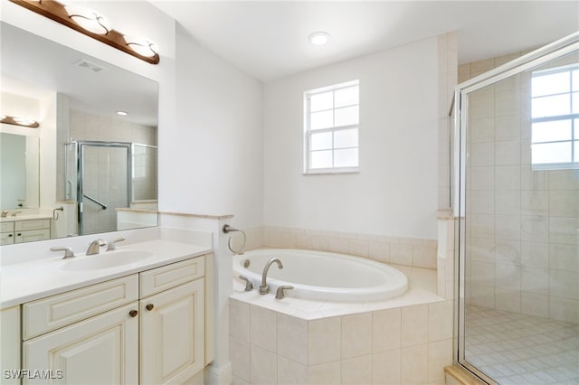 full bathroom featuring visible vents, a wealth of natural light, a garden tub, and a stall shower